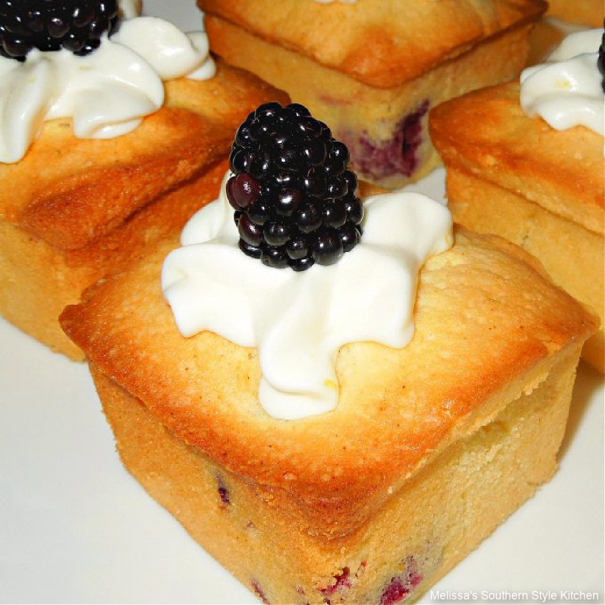 https://www.melissassouthernstylekitchen.com/wp-content/uploads/2012/04/Blackberries-and-Cream-Mini-Pound-Cakes-1.jpg