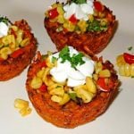assembled Creole Sweet Potato Nests with sour cream and corn relish