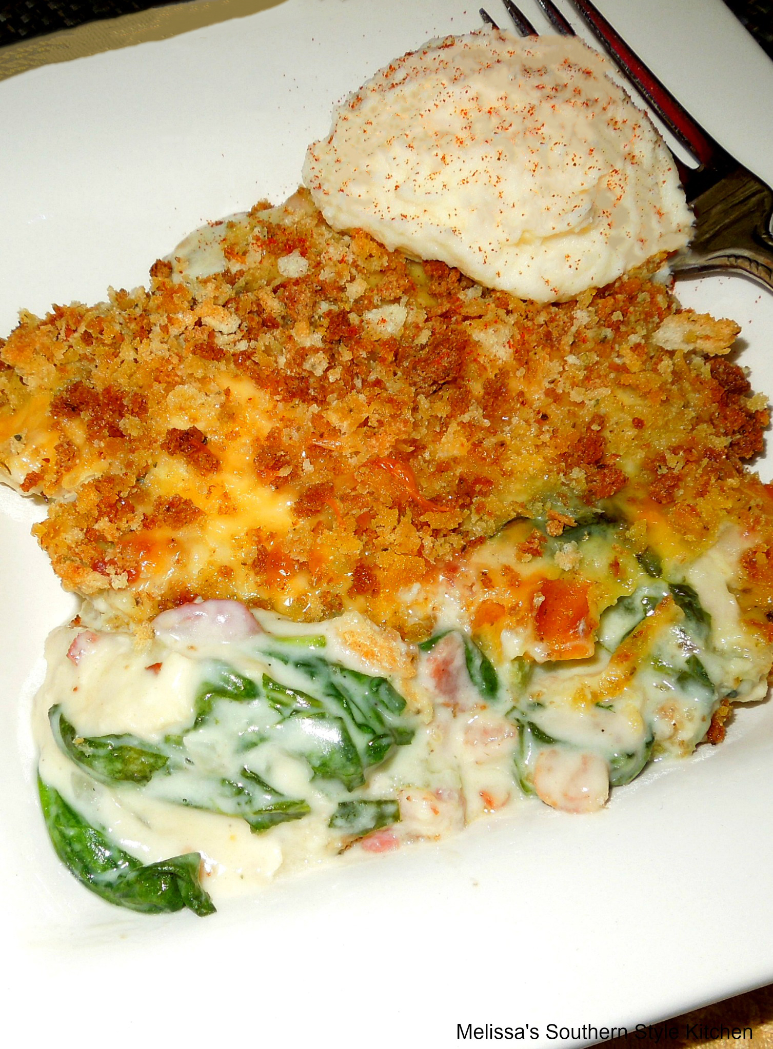 Turkey casserole on a plate with mashed potatoes