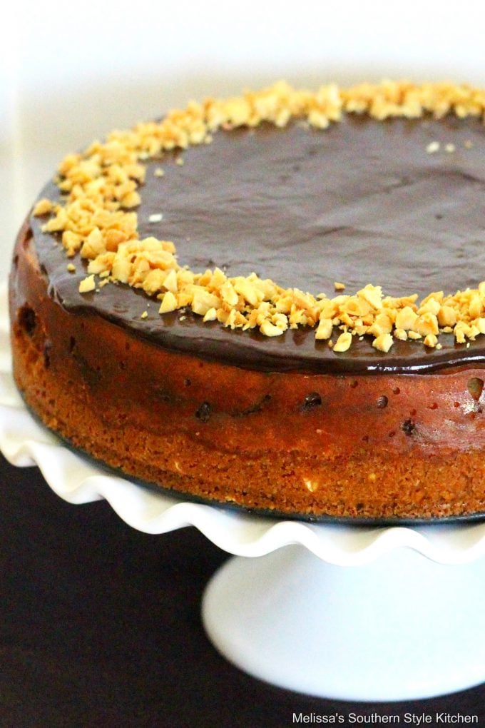 Peanut Butter Cup Cheesecake on a cake stand