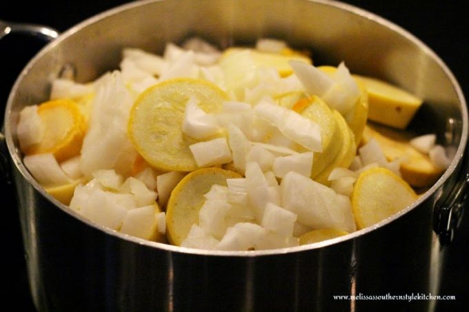 sliced squash and onion in a pot