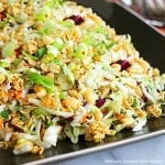 Asian inspired coleslaw with ramen noodles and peanuts in a square brown dish