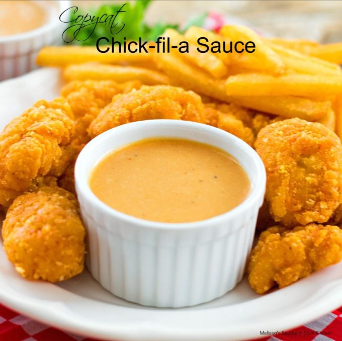 Copycat Chick-fil-A Sauce on a plate with chicken nuggets and french fries 