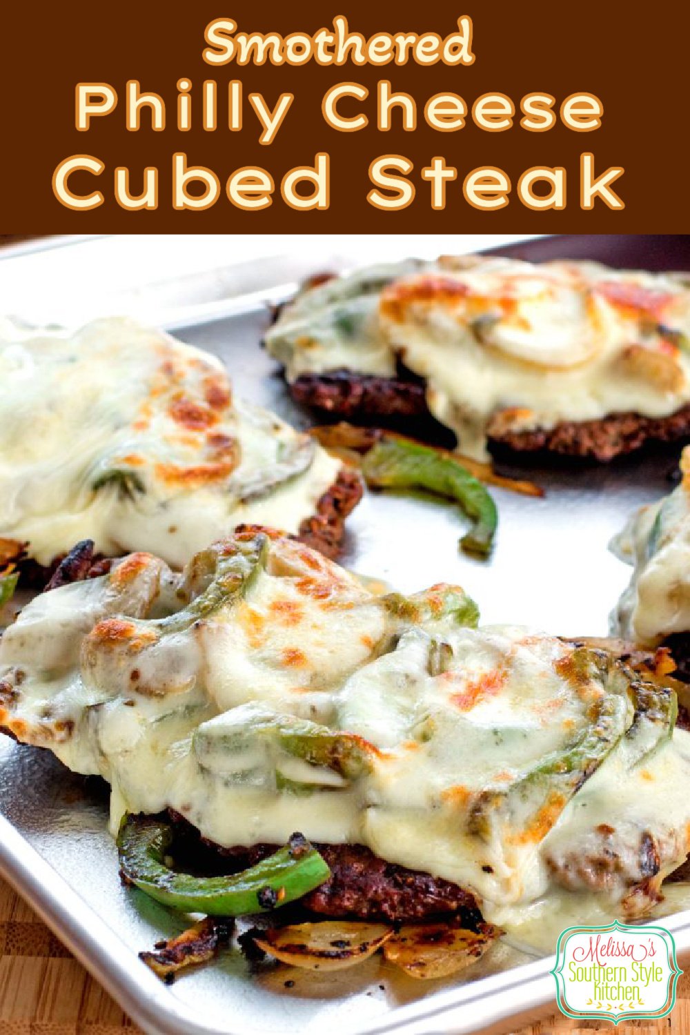 Gooey Smothered Philly Cheese Cubed Steak topped with sweet onions, bell peppers and melted cheese #cheesesteaks #cubesteak #phillycheesesteak #lowcarbrecipes #lowcarb #beef #easyrecipes #southernrecipes