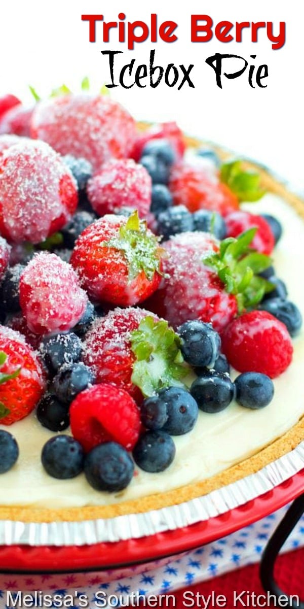 Top this decadent No Bake Triple Berry Icebox Pie with a drizzle of warm white chocolate and grated white chocolate bar for the finish #nobakepie #iceboxpie #tripleberry #tripleberrypie #freshberries #berrypie #blueberries #strawberries #pierecipes #desserts #desssertfoodrecipes #sweets #southernfood #southernrecipes