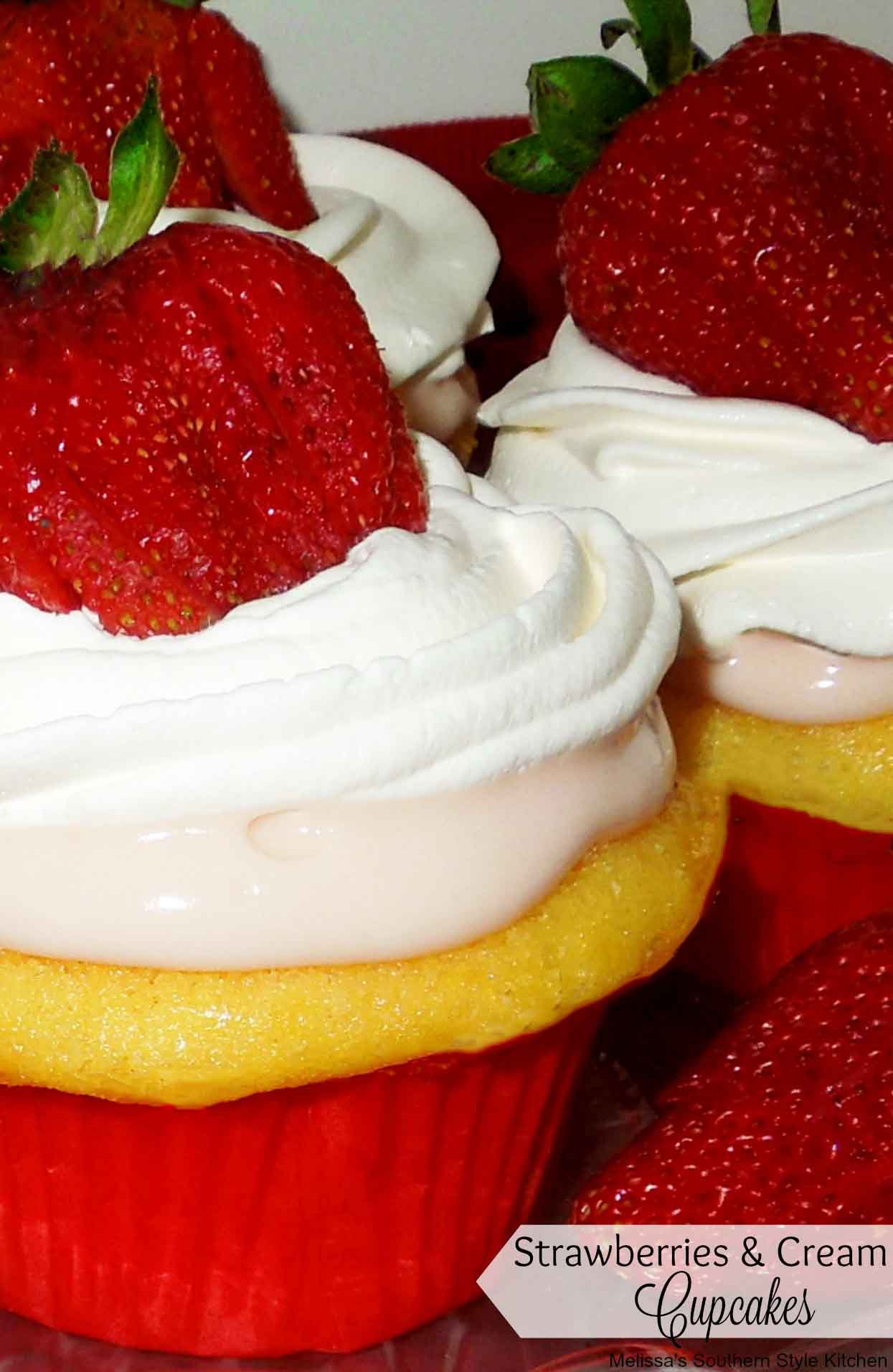 three decorated Strawberries and Cream Filled Cupcakes