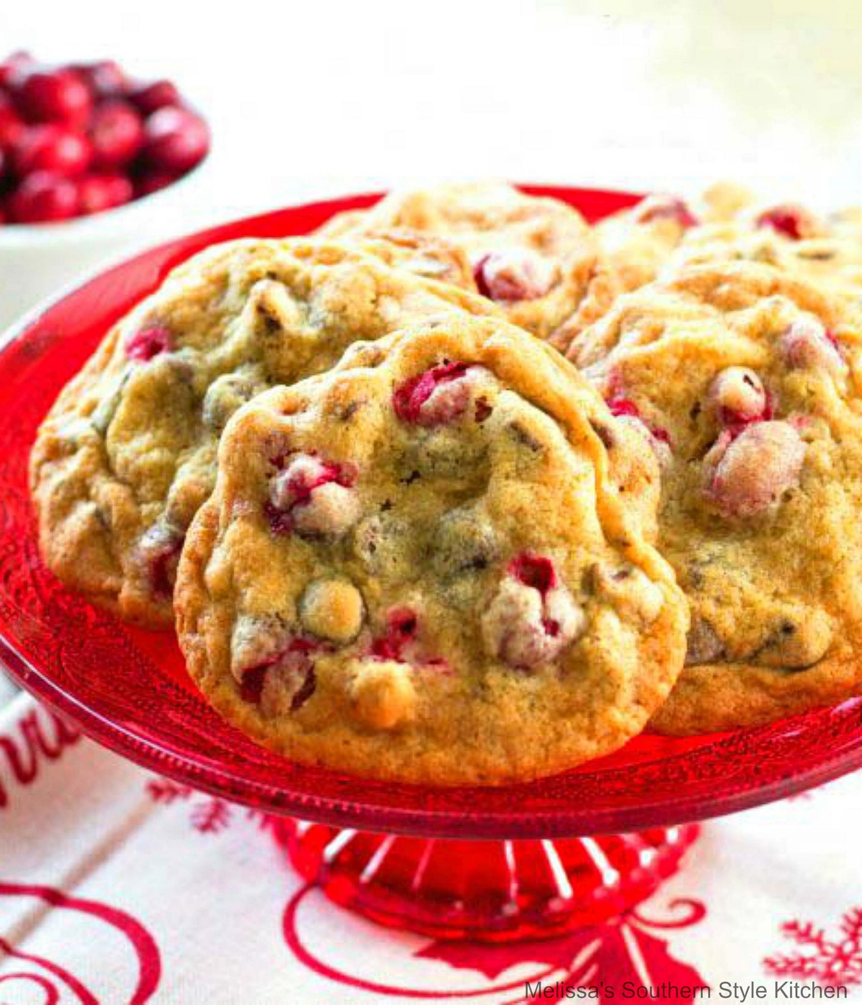 baked Cranberry Walnut Chocolate Chip Cookies on a cake stand 