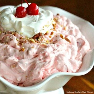 Cherry pie fluff garnished with cherries in a white bowl