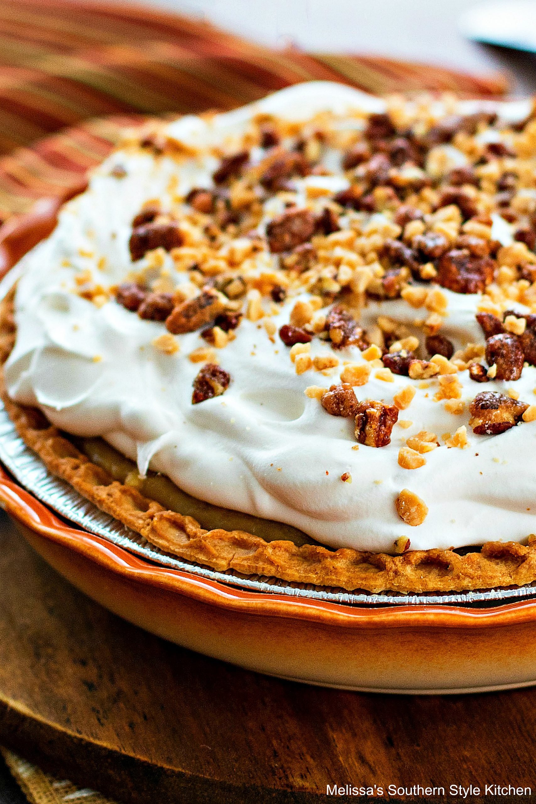 Whole caramel pie with whipped cream, pecan and bits-o-brickle