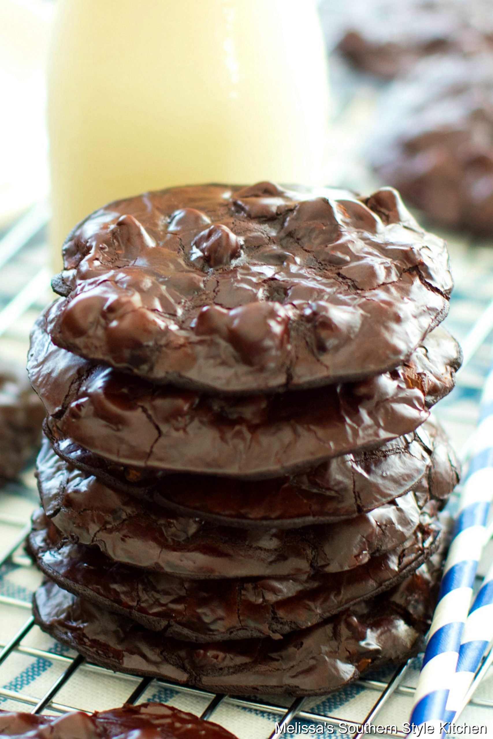 Stacked Flourless Chocolate Cookies on a cooling rack