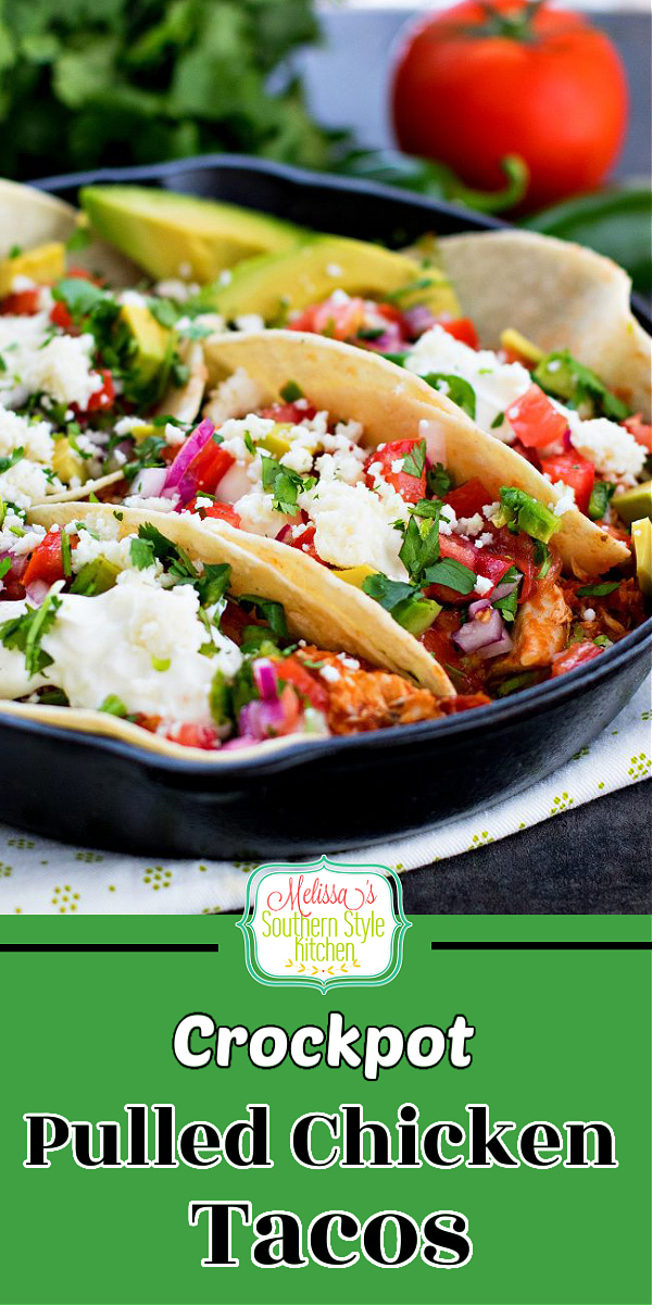 Simmered in a slow cooker these Crockpot Pulled Chicken Tacos will create a homestyle fiesta any night of the week #chickentacos #crockpotchicken #tacos #easychickenbreastrecipes #chicken #slowcookerchicken #crockpotrecipes #TacoTuesday #dinnerideas #dinner #southernfood #southernrecipes #mexicanfood