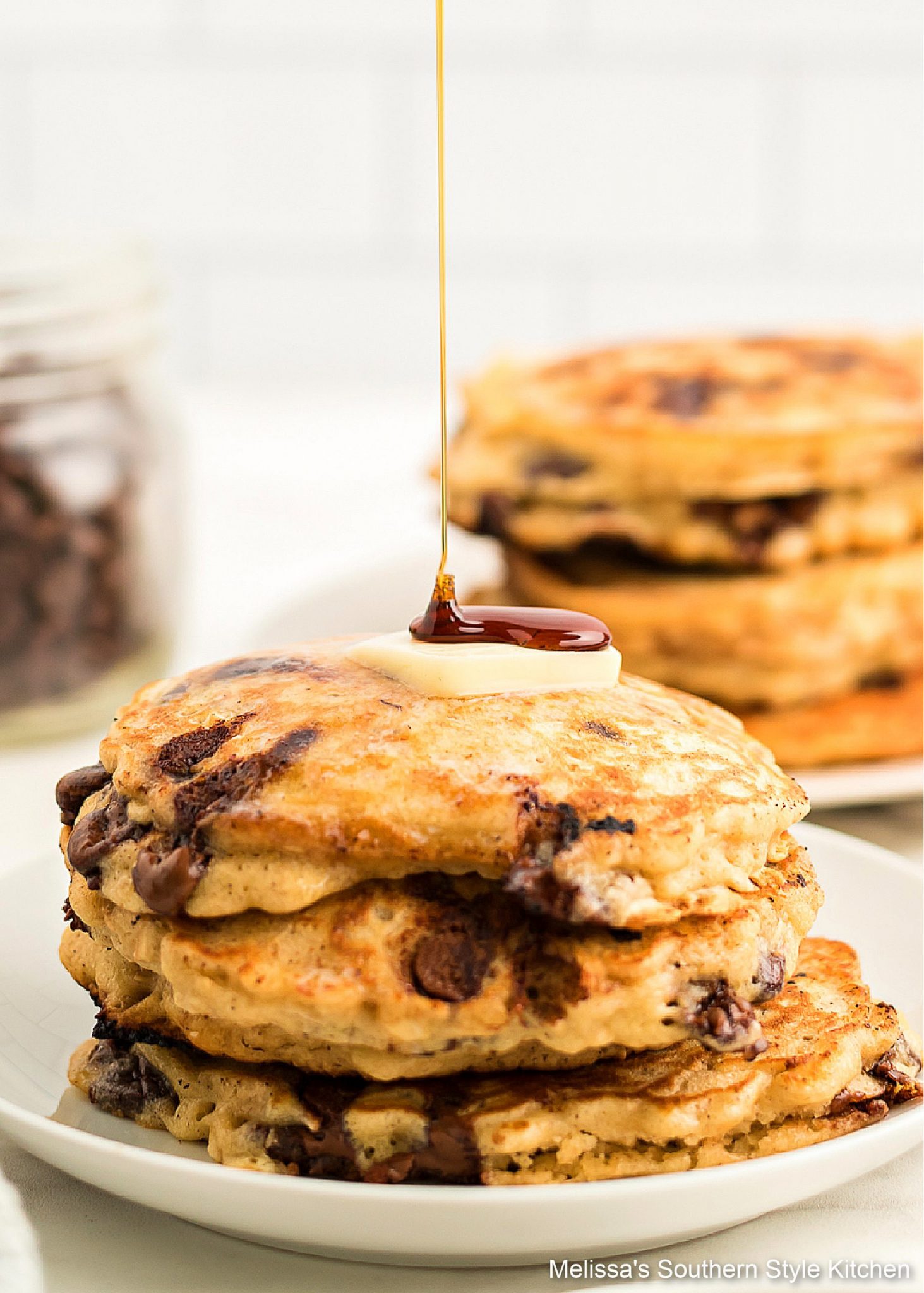 syrup drizzled Oatmeal Chocolate Chip Pancakes on a plate