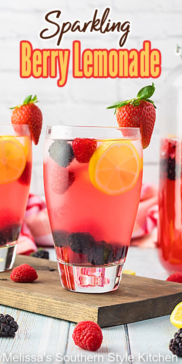 Cool down in style on a hot day with a tall glass of  chilled Sparkling Berry Lemonade garnished with berries or a sprig of mint. #lemonade #sparklinglemonade #berrylemonade #lemonaderecipes #strawberrylemonade #nonalcoholicdrinks #familyfriendlydrinks #southernrecipes