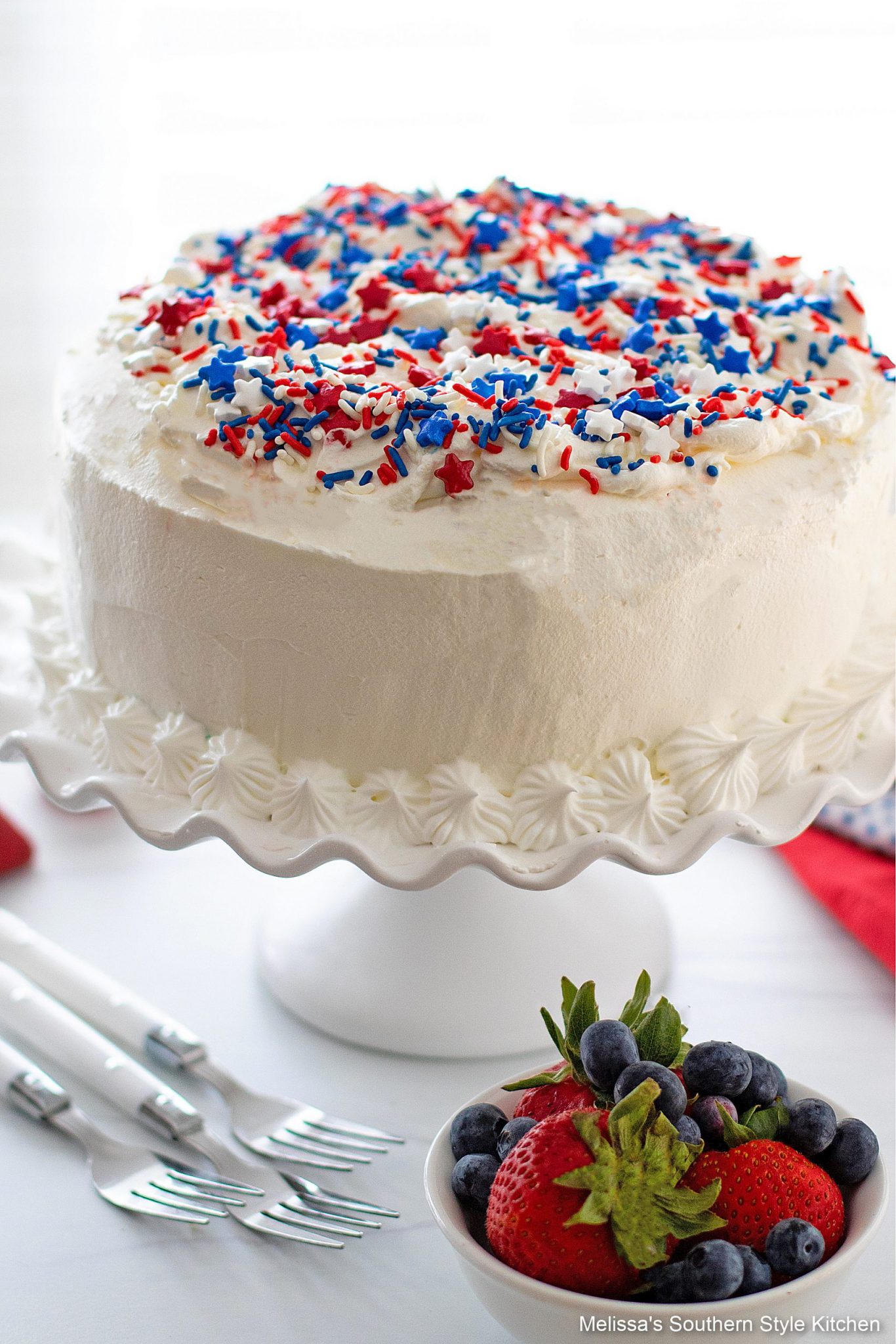 Red White and Blue Ice Cream Cake on a cake stand 