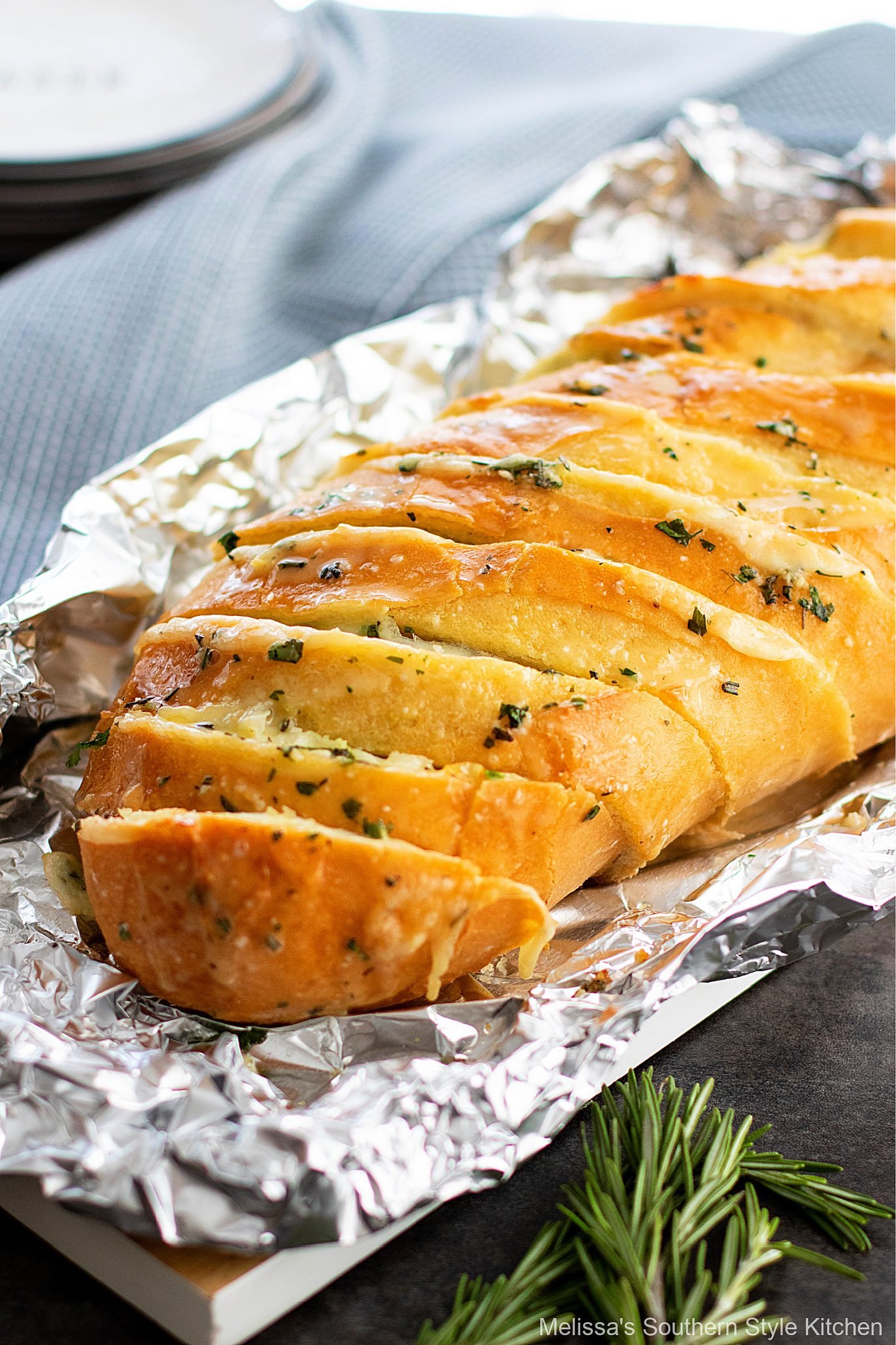 sliced Cheesy Garlic Herb Bread on a platter