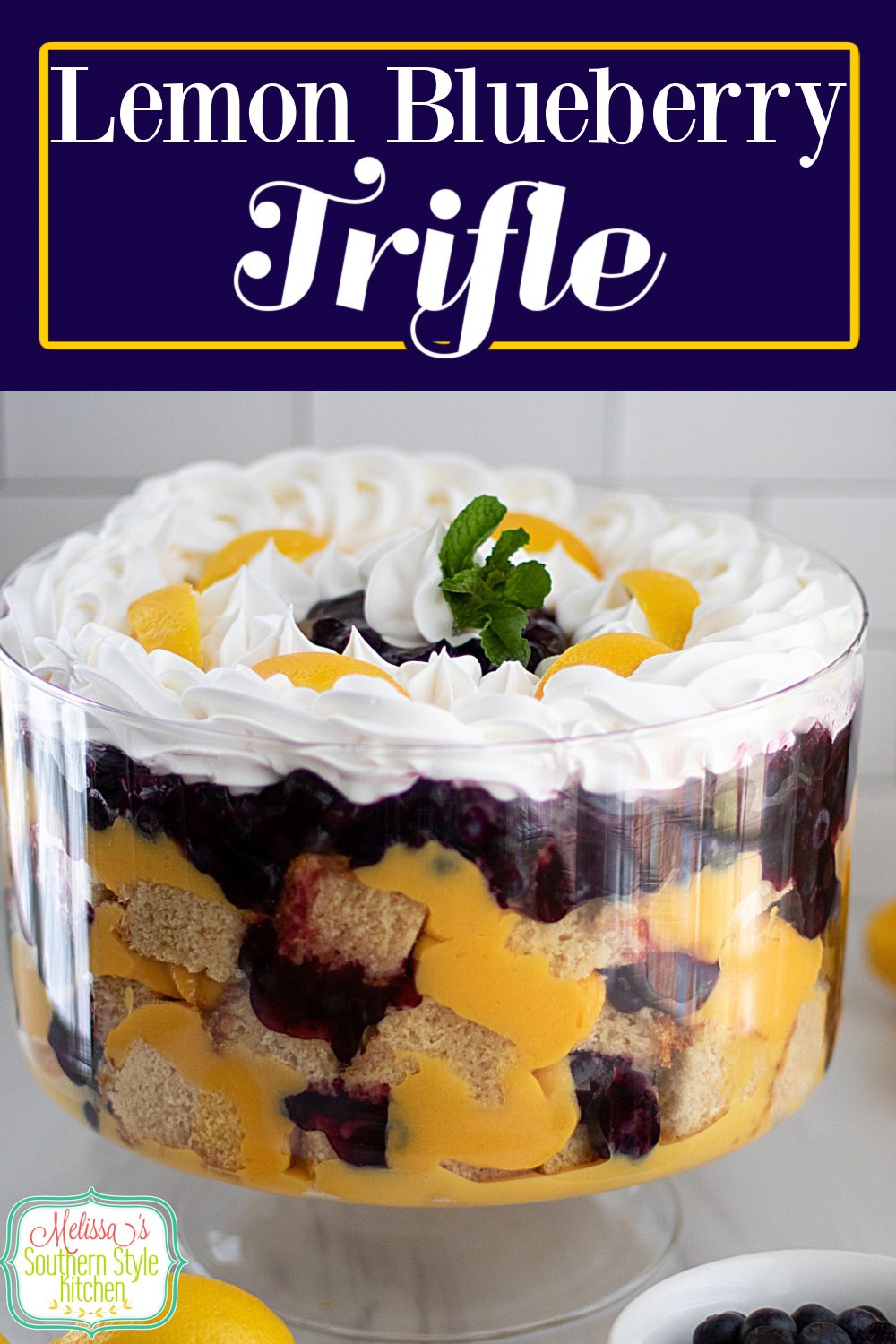 This stunning Blueberry Lemon Trifle recipe is an edible centerpiece guaranteed to add height and beauty to the dessert table #blueberrylemontrifle #lemontriflerecipe #bestlemontriflerecipe #blueberries #lemondesserts #poundcaketrifle via @melissasssk