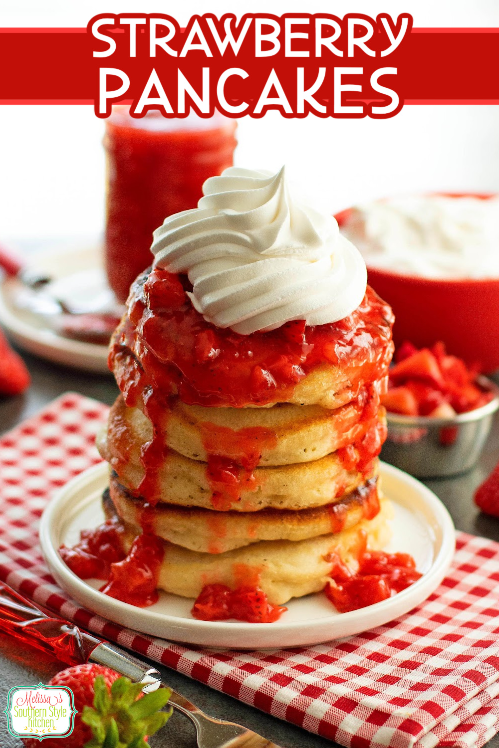 These fluffy Strawberry Pancakes are filled with fresh strawberries and topped with homemade strawberry sauce and a dollop of whipped cream. #strawberrypancakes #buttermilkpancakes #pancakerecipes #strawberries #stgraberrydesserts #brunchrecipes #strawberryshortcake